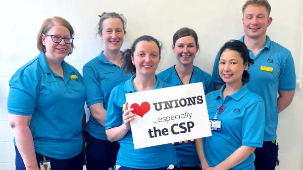 Workplace wins picture of a group of stewards and safety reps holding a sign which reads Heart Unions especially the CSP