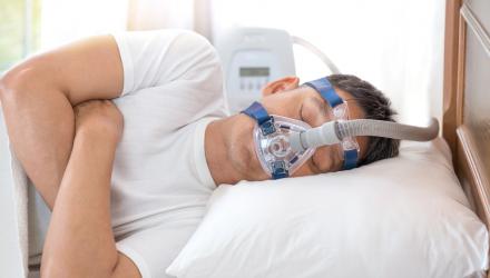 Patient using a continuous positive airway pressure machine